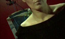 Beautiful brunette likes to watch herself undressing through the mirror