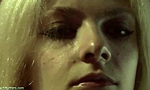 look at the blonde beauty putting on lipstick in see-through lingerie