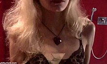 look at the blonde beauty putting on lipstick in see-through lingerie