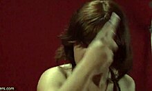 This bestial brunette in wild lingerie is undressing in front of the mirror.