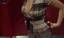 Spicy brunette undresses in changing room for hidden cam