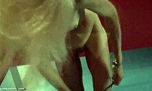 look at the blonde beauty putting on lipstick in see-through lingerie