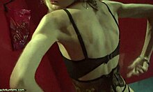 look at the blonde beauty putting on lipstick in see-through lingerie