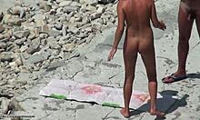 Tanned blonde girlfriend shows hot body on beach