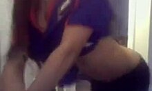 Curly-haired ebony hottie flashing her big tits on cam