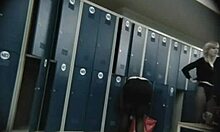 blonde business woman is being watched while undressing