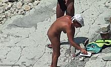 Tanned blonde girlfriend shows hot body on beach