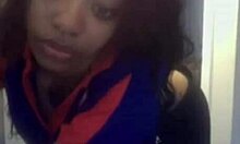 Curly-haired ebony hottie flashing her big tits on cam