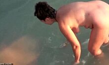 Hey, check my dark-haired chubby girlfriend skinny dipping at nudist beach! 🏖️