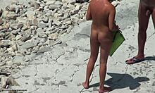 Tanned blonde girlfriend shows hot body on beach