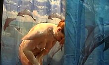 busty redhead is taking care of her dirty sinful body under the shower