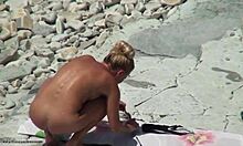 Tanned blonde girlfriend shows hot body on beach