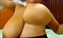 latina in fishnets playing with her big boobs on webcam 😘