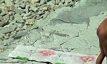 Tanned blonde girlfriend shows hot body on beach