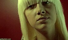 spy on this hot blonde changing and fixing herself up in the mirror.