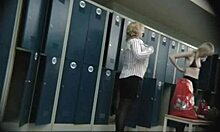 blonde business woman is being watched while undressing