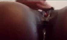 close-up view of an ebony babe masturbating her juicy ass and clit