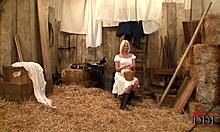 Blond-haired bombshell in white costume with cowboy in barn