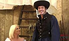 Blond-haired bombshell in white costume with cowboy in barn