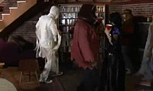 blond and dark-haired friends in a group scene with actor