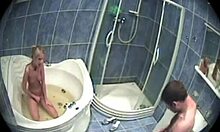 Blond-haired beauty enjoys a relaxing session with her boyfriend in a hot tub.