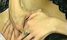 Two stockings-clad chic-looking girlfriends double teaming a massive cock