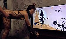 Excited sex doll in black bodystocking is sucking on the knees