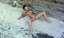 Shaved Brunette Babe Poses Naked Outdoors Displaying Perfect Natural Breasts On The Beach