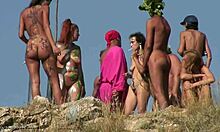 Kinky nudists enjoy body art and nerdy cosplay on the beach.