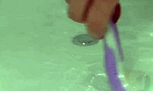 Young cute girl smiles as she shaves her legs