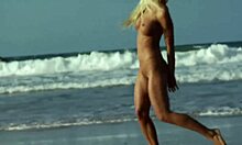 Stunning Blonde Posing Seductively on a Sandy Beach Shore