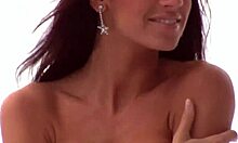 Smoldering brunette poses naked in the snow, feeling the chill