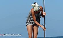naked brunette squatting on beach looking damn hot