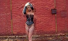 Dominatrix blonde reveals her pussy emotions by the wall