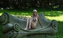 this scrawny blonde with a tight body is posing naked outdoors, showing off her beautiful ass