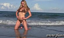 Blond-Haired Babe Posing Seductively on Beach