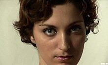 Curly-haired amateur GF shows perky ass in bedroom striptease