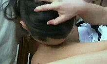 Brunette model Jennifer Love poses in a sensual photoshoot with artistic lighting and elegant attire.