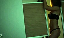 guerlain in black lingerie posin by big window, so hot