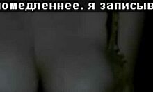 Russian mature amateur flashes big tits in dark striptease.
