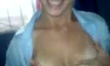 tanned brunette strips and shows big tits