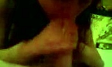 The brunette housewife eagerly sucks a big cock on her homemade bed.