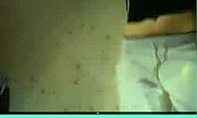 short-haired blonde milf strips on webcam, showing her tits.