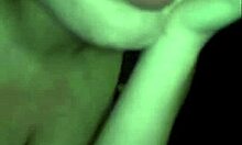 Russian mature amateur flashes big tits in dark striptease.