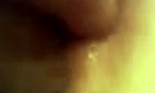 Detailed close-up view of a horny amateur wife getting her anal fingered intensely by her partner.