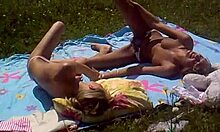 Look at these two slutty girlfriends sunbathing topless on the beach!