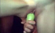 Kinky amateur fucks tight pussy with vegetable.
