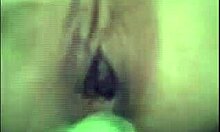 Kinky amateur fucks tight pussy with vegetable.