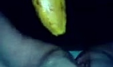 horny amateur goes wild with a banana on camera, close-up of her shaved pussy masturbation.