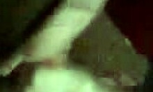 Dark-haired amateur in red sucks uncut cock suggestively.